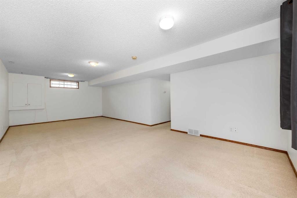 28 Coral Reef Link Ne, Calgary, AB - Indoor Photo Showing Other Room