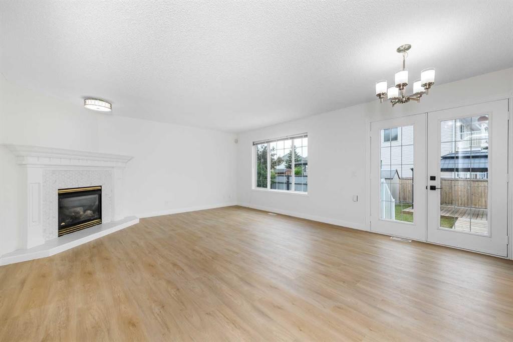 28 Coral Reef Link Ne, Calgary, AB - Indoor Photo Showing Living Room With Fireplace