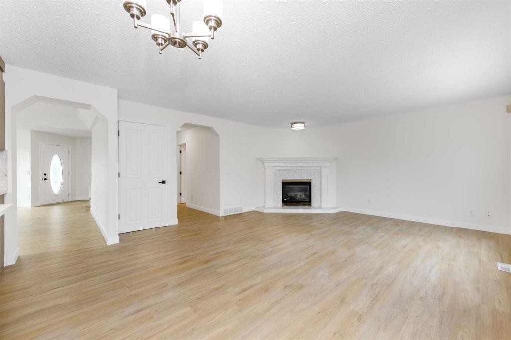 28 Coral Reef Link Ne, Calgary, AB - Indoor Photo Showing Living Room With Fireplace