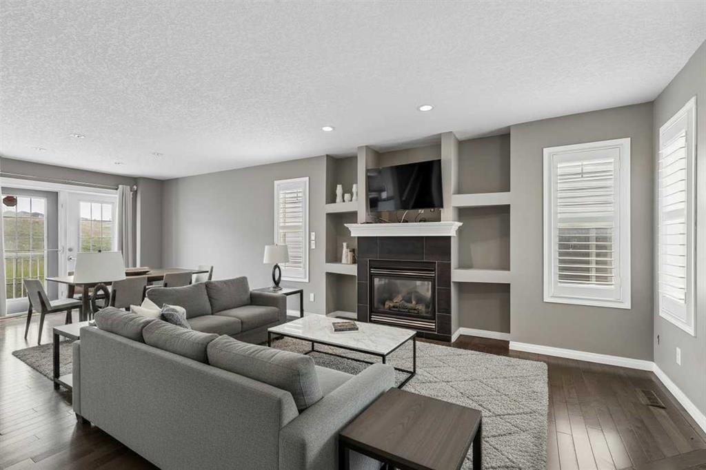 139 Hidden Creek Gardens Nw, Calgary, AB - Indoor Photo Showing Living Room With Fireplace