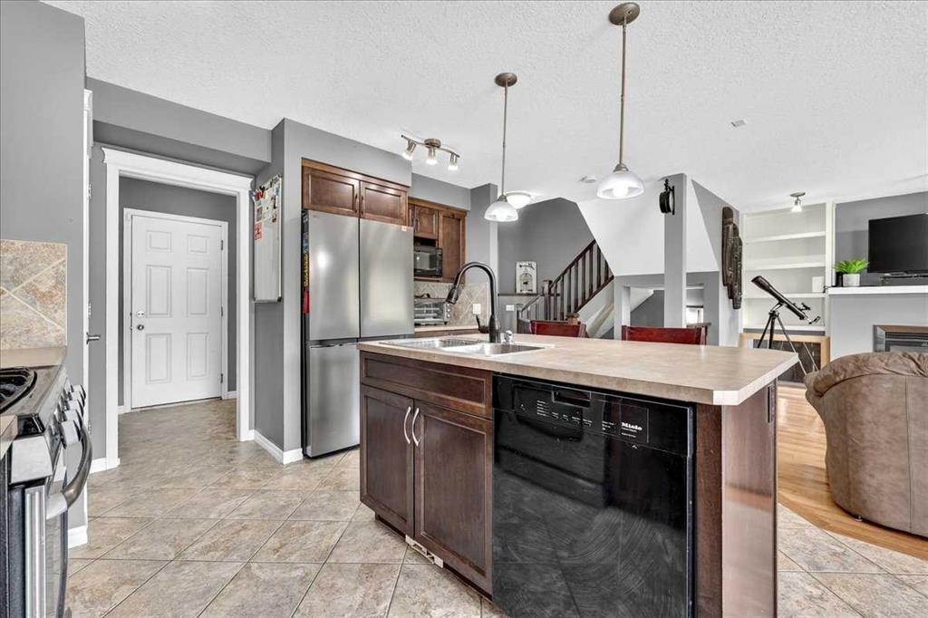 128 Cranberry Circle Se, Calgary, AB - Indoor Photo Showing Kitchen With Stainless Steel Kitchen With Double Sink