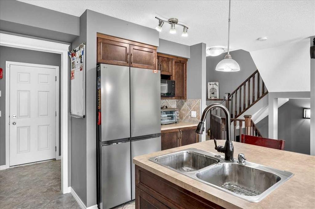 128 Cranberry Circle Se, Calgary, AB - Indoor Photo Showing Kitchen With Double Sink