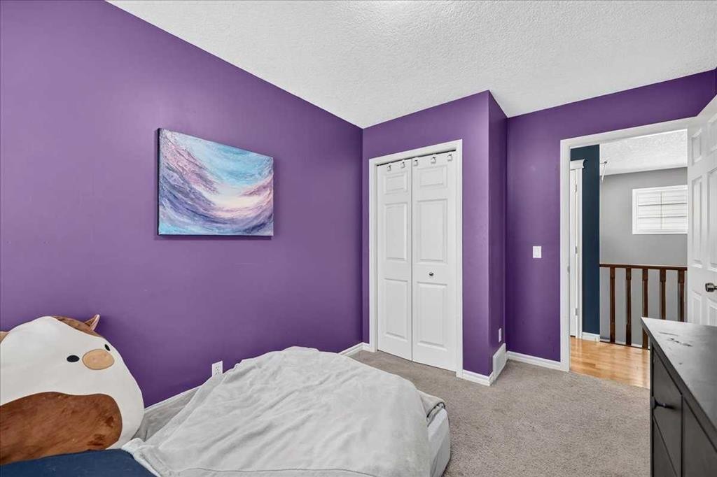 128 Cranberry Circle Se, Calgary, AB - Indoor Photo Showing Bedroom