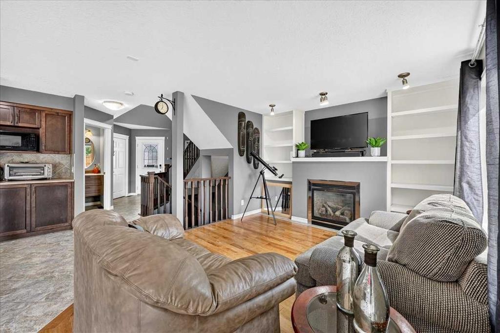 128 Cranberry Circle Se, Calgary, AB - Indoor Photo Showing Living Room With Fireplace