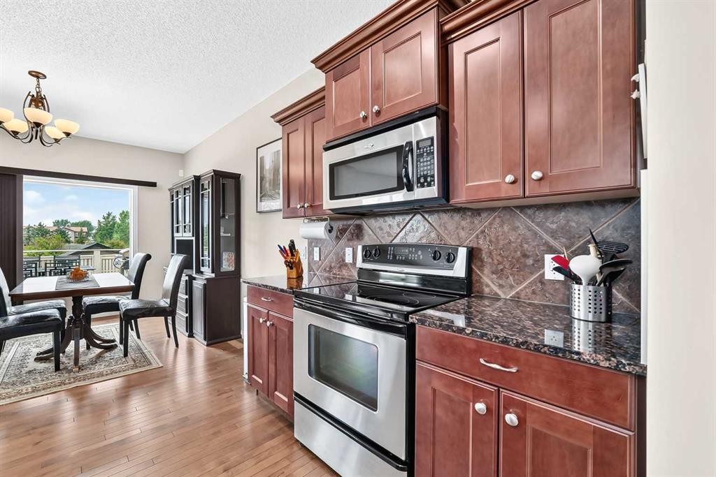212 Aspenmere Close, Chestermere, AB - Indoor Photo Showing Kitchen With Stainless Steel Kitchen