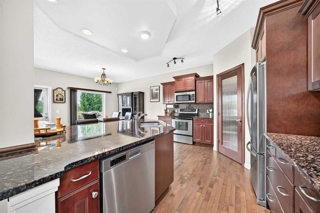 212 Aspenmere Close, Chestermere, AB - Indoor Photo Showing Kitchen With Stainless Steel Kitchen With Upgraded Kitchen