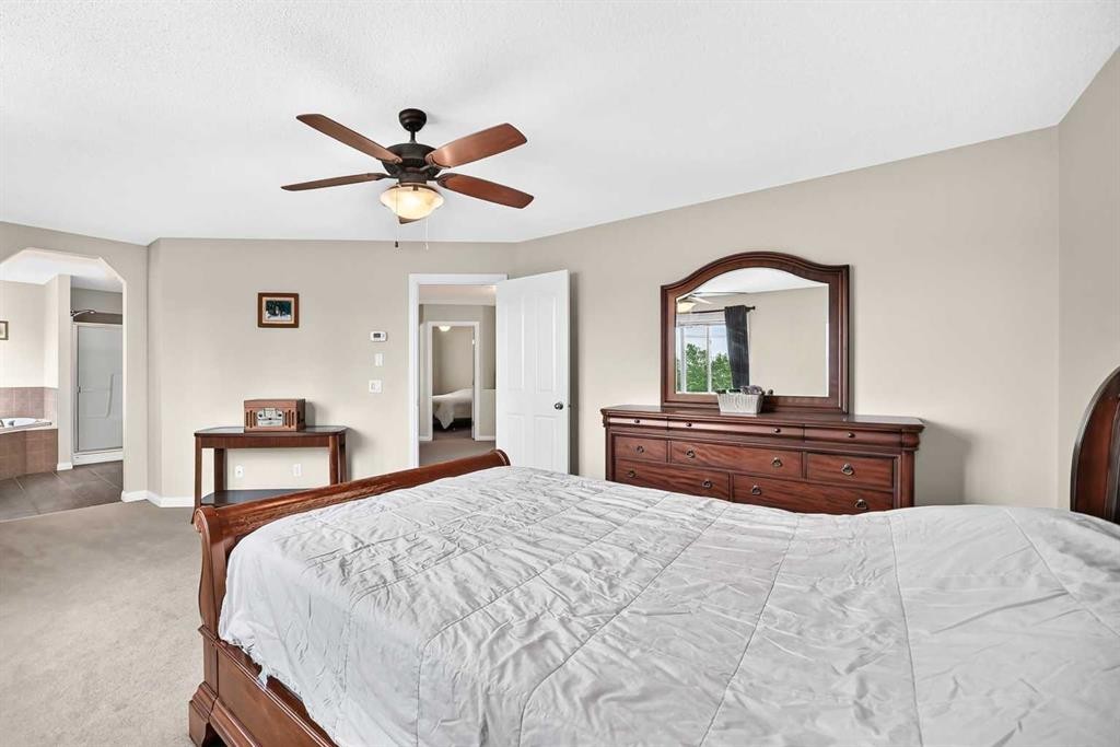 212 Aspenmere Close, Chestermere, AB - Indoor Photo Showing Bedroom