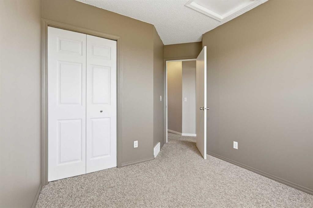 129 Hidden Spring Circle Nw, Calgary, AB - Indoor Photo Showing Other Room