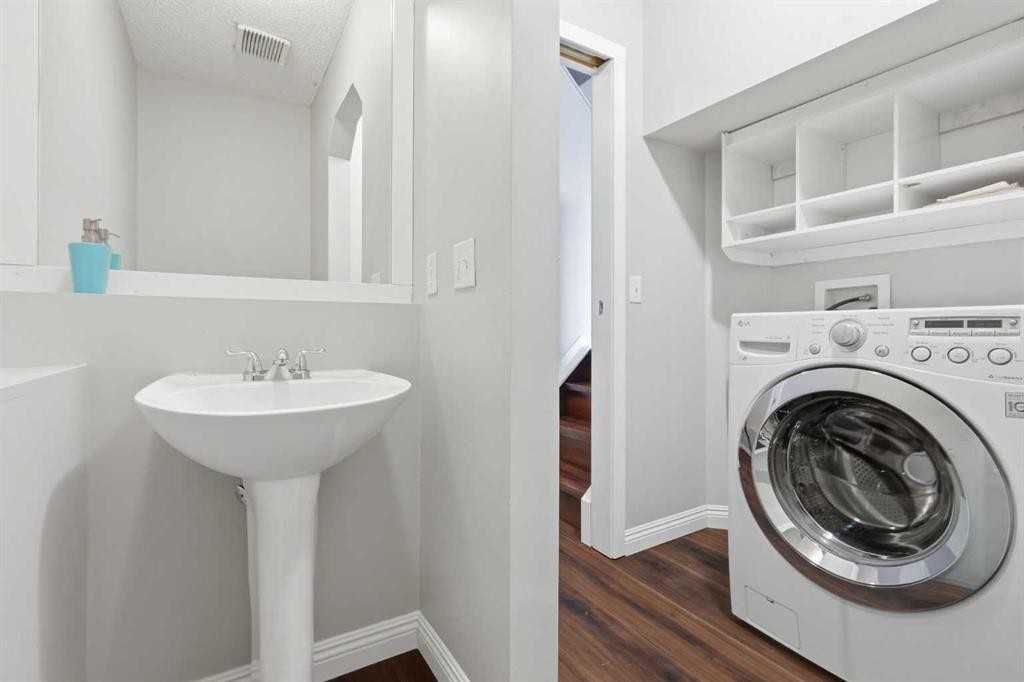 129 Hidden Spring Circle Nw, Calgary, AB - Indoor Photo Showing Laundry Room