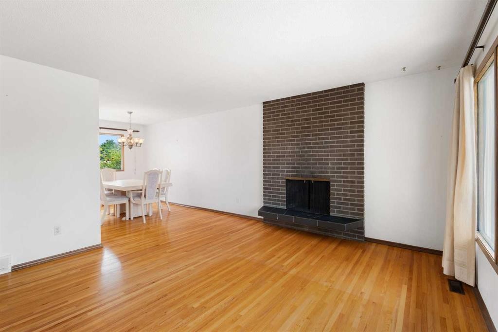 6008 Dalgetty Drive Nw, Calgary, AB - Indoor Photo Showing Living Room With Fireplace