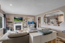 112 Penmeadows Close Se, Calgary, AB  - Indoor Photo Showing Living Room With Fireplace 