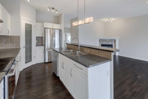 103 Bridle Estates Mews Sw, Calgary, AB - Indoor Photo Showing Kitchen With Stainless Steel Kitchen With Double Sink With Upgraded Kitchen