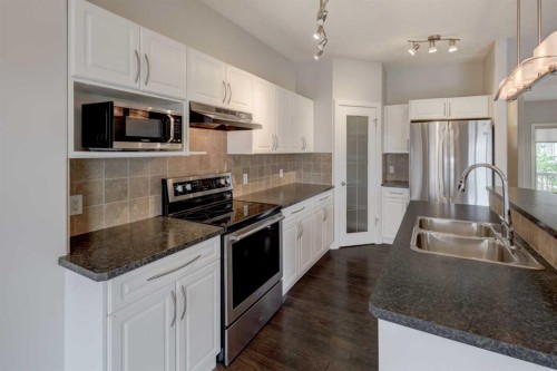 103 Bridle Estates Mews Sw, Calgary, AB - Indoor Photo Showing Kitchen With Stainless Steel Kitchen With Double Sink With Upgraded Kitchen