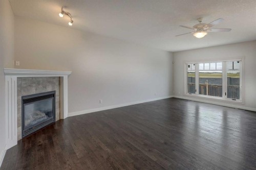 103 Bridle Estates Mews Sw, Calgary, AB - Indoor Photo Showing Living Room With Fireplace