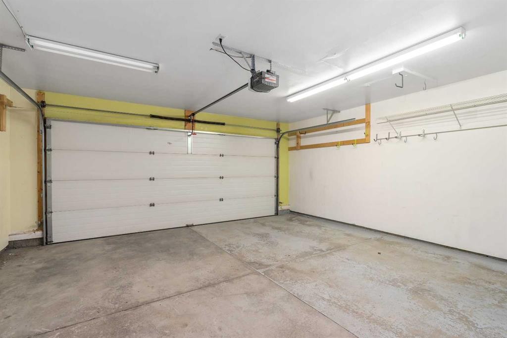 205 Mckenzie Towne Gate Se, Calgary, AB - Indoor Photo Showing Garage
