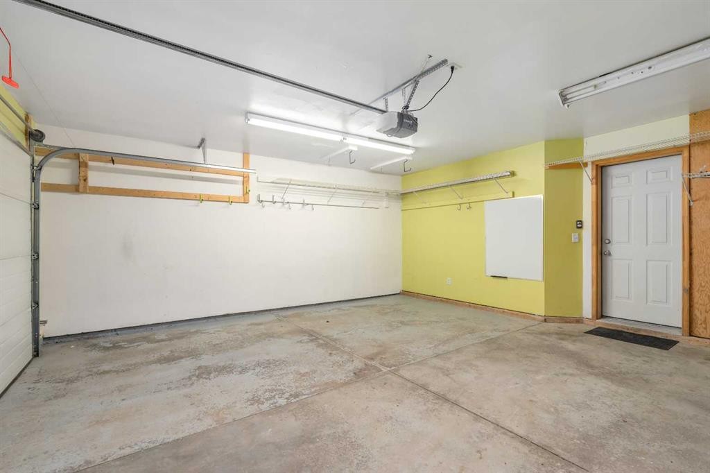 205 Mckenzie Towne Gate Se, Calgary, AB - Indoor Photo Showing Garage