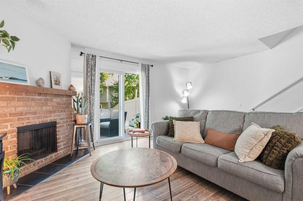 6503 Ranchview Drive Nw, Calgary, AB - Indoor Photo Showing Living Room With Fireplace