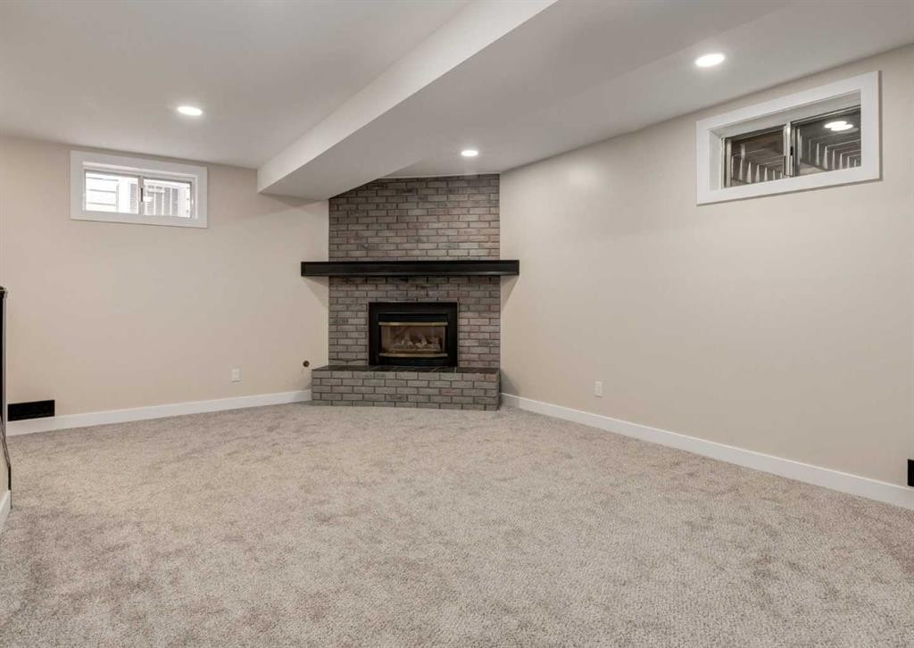 7956 71 Avenue Nw, Calgary, AB - Indoor Photo Showing Basement With Fireplace