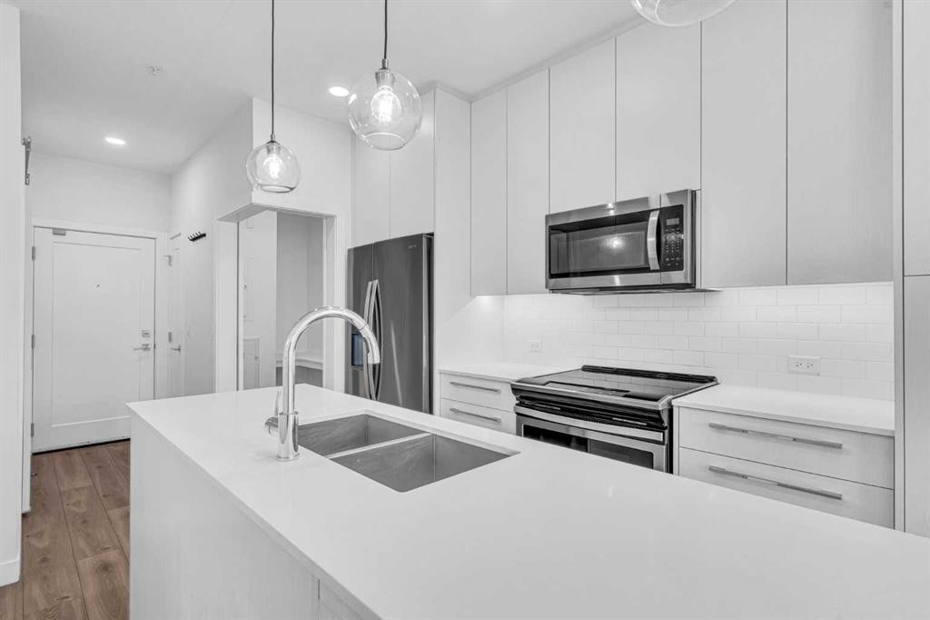 1119-76 Cornerstone Passage Ne, Calgary, AB - Indoor Photo Showing Kitchen With Double Sink With Upgraded Kitchen