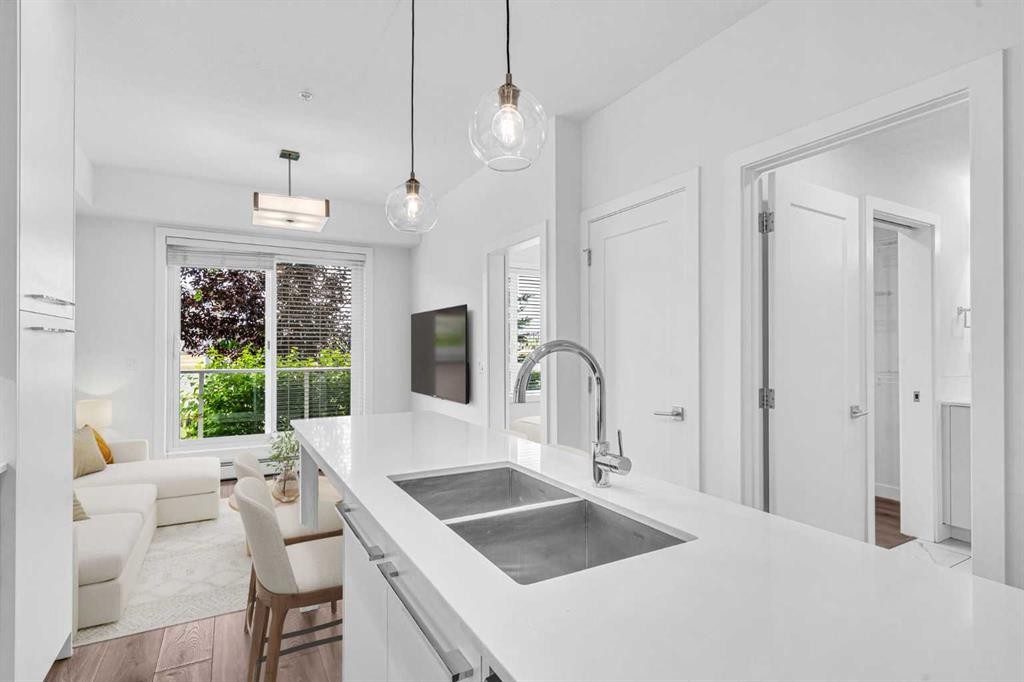 1119-76 Cornerstone Passage Ne, Calgary, AB - Indoor Photo Showing Kitchen With Double Sink
