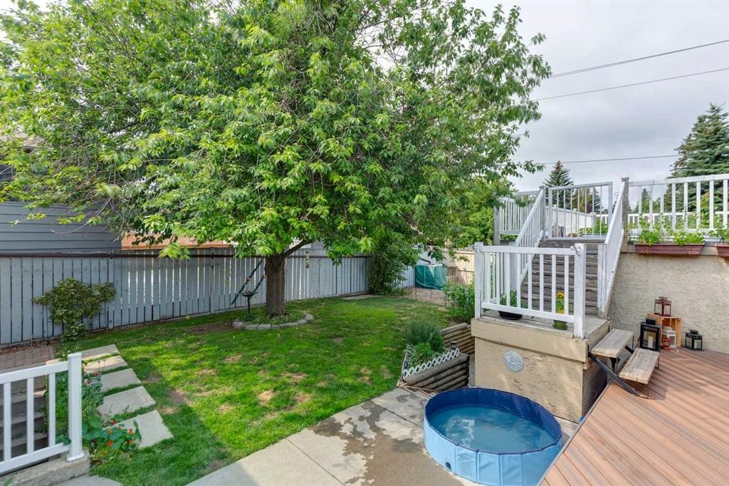 107 Bermuda Drive Nw, Calgary, AB - Outdoor With Deck Patio Veranda With Backyard