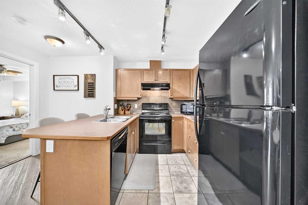 208-30 Cranfield Link Se, Calgary, AB - Indoor Photo Showing Kitchen With Double Sink