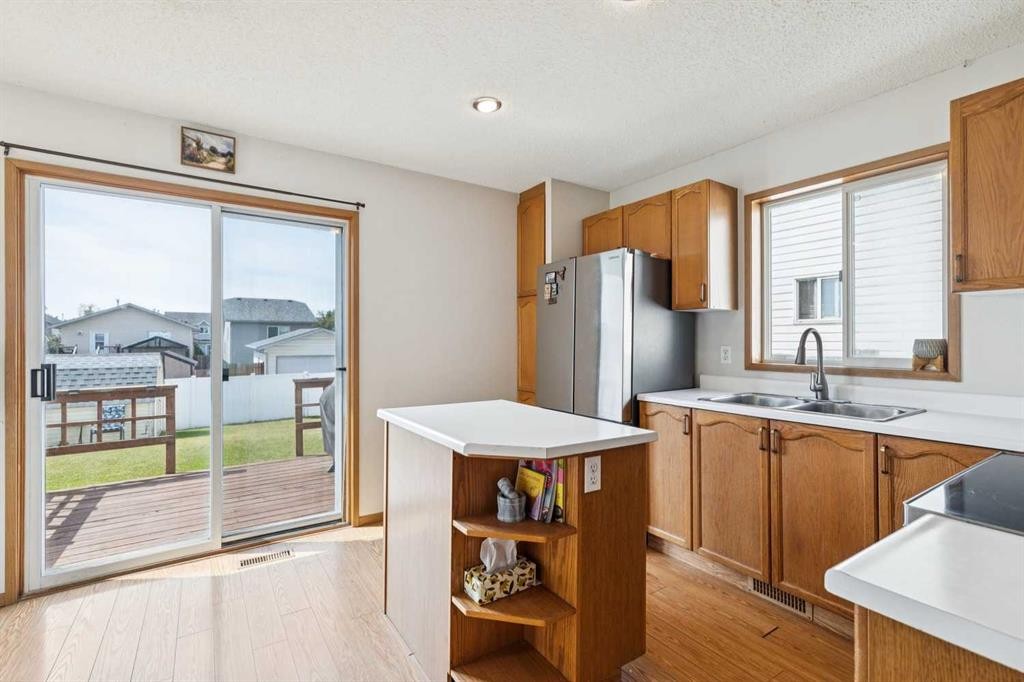 151 Rivercrest Close Se, Calgary, AB - Indoor Photo Showing Kitchen With Double Sink