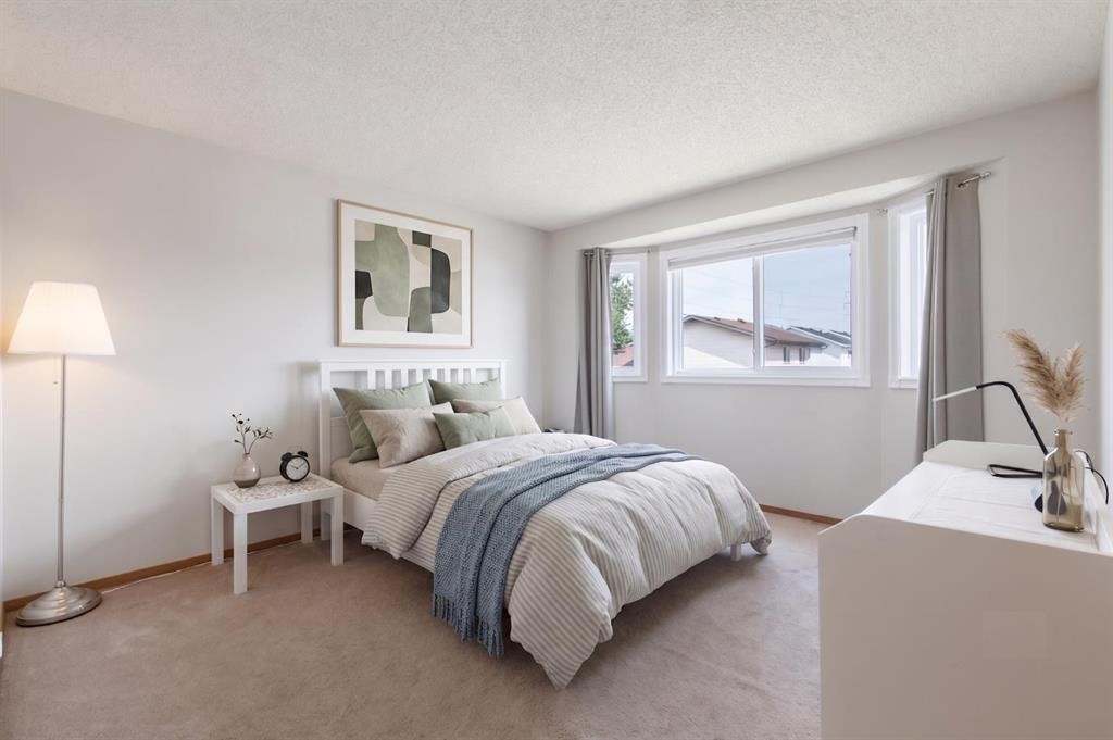 151 Rivercrest Close Se, Calgary, AB - Indoor Photo Showing Bedroom