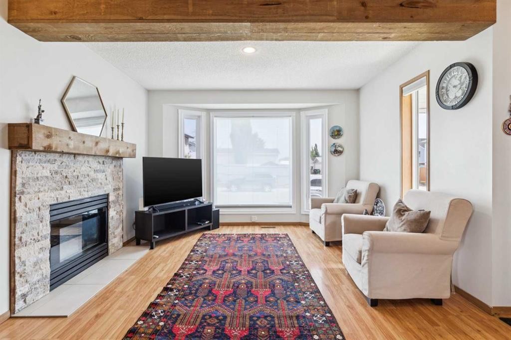 151 Rivercrest Close Se, Calgary, AB - Indoor Photo Showing Living Room With Fireplace