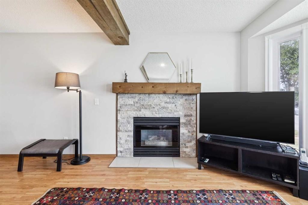 151 Rivercrest Close Se, Calgary, AB - Indoor Photo Showing Living Room With Fireplace