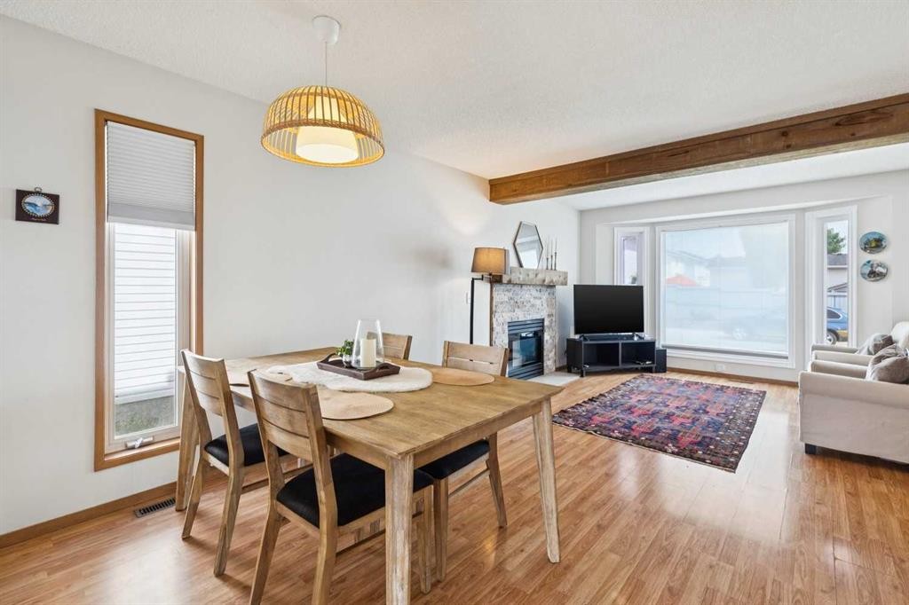 151 Rivercrest Close Se, Calgary, AB - Indoor Photo Showing Living Room With Fireplace