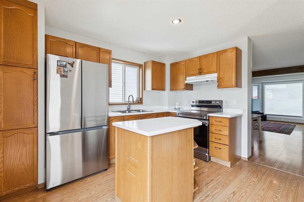 151 Rivercrest Close Se, Calgary, AB - Indoor Photo Showing Kitchen With Double Sink