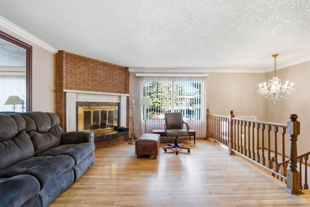 16 Dalroy Crescent Nw, Calgary, AB - Indoor Photo Showing Living Room With Fireplace