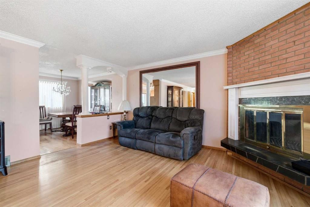 16 Dalroy Crescent Nw, Calgary, AB - Indoor Photo Showing Living Room With Fireplace