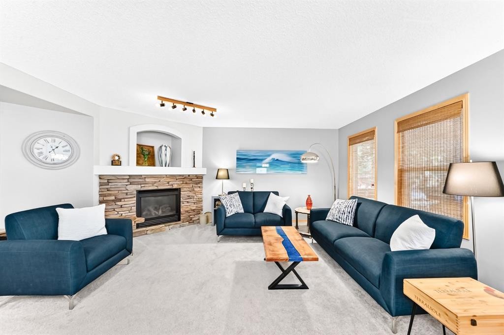 206 Panamount Grove Nw, Calgary, AB - Indoor Photo Showing Living Room With Fireplace