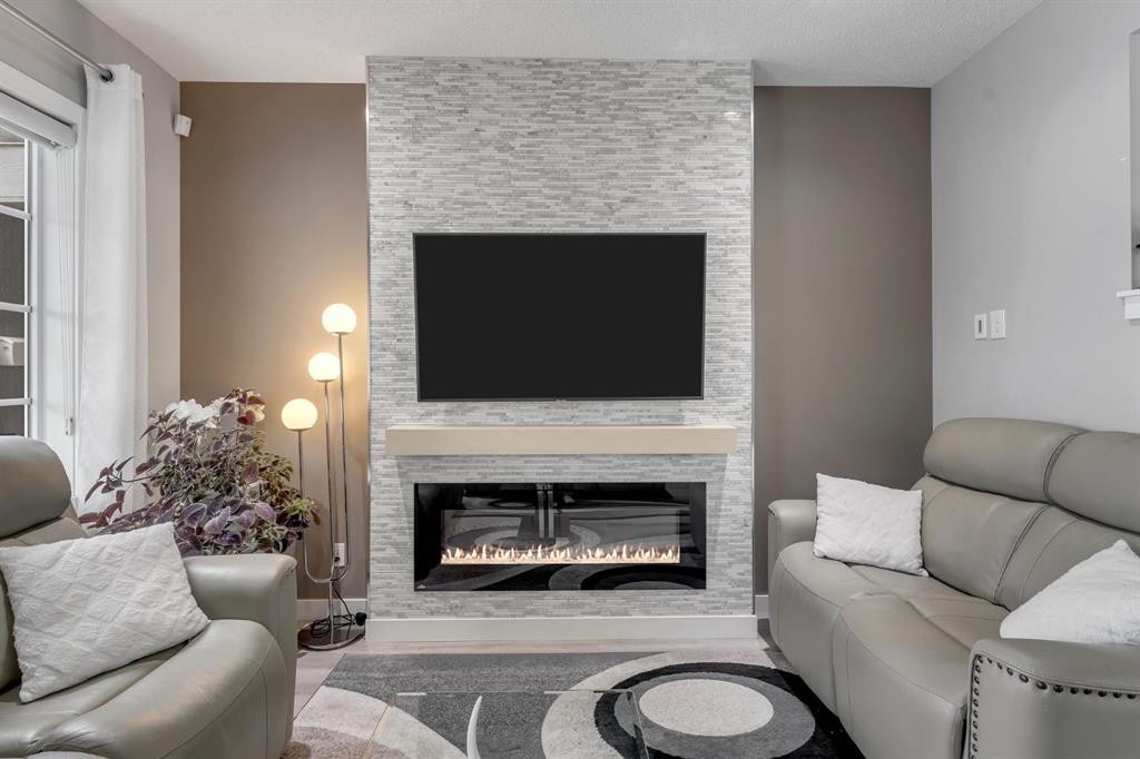 160 Cornerstone Avenue Ne, Calgary, AB - Indoor Photo Showing Living Room With Fireplace
