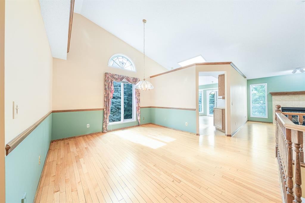 22 Douglas Woods Park Se, Calgary, AB - Indoor Photo Showing Other Room With Fireplace