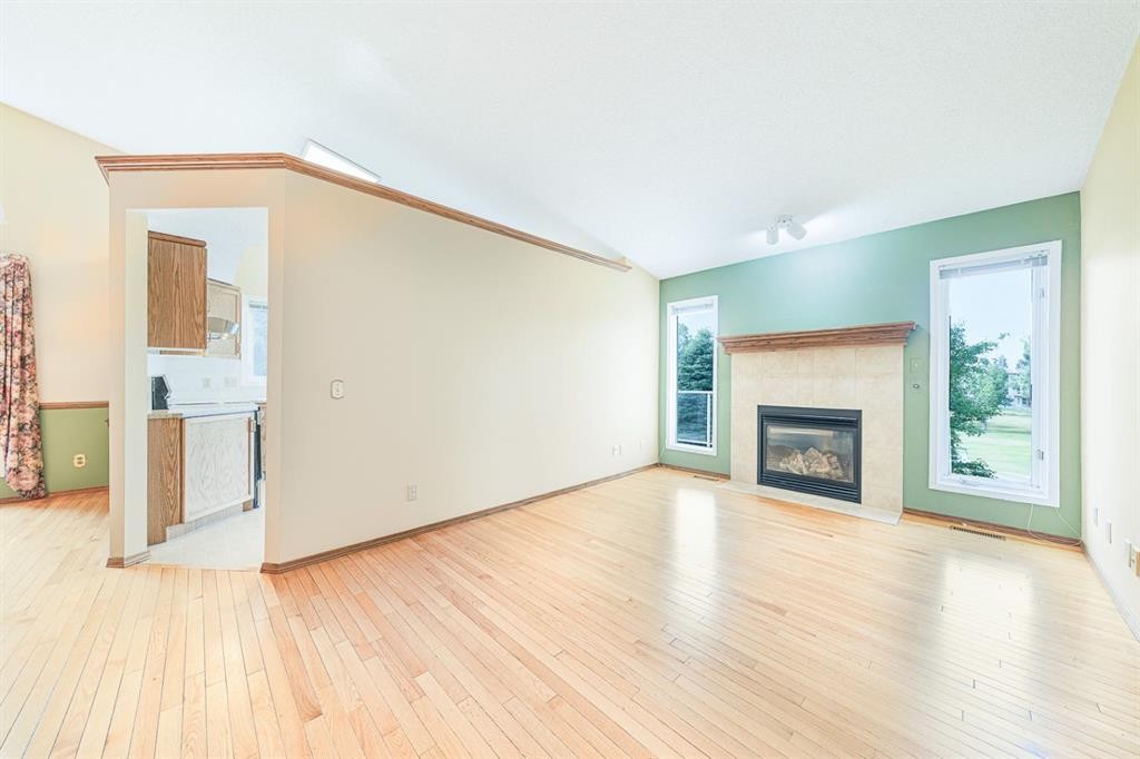 22 Douglas Woods Park Se, Calgary, AB - Indoor Photo Showing Living Room With Fireplace
