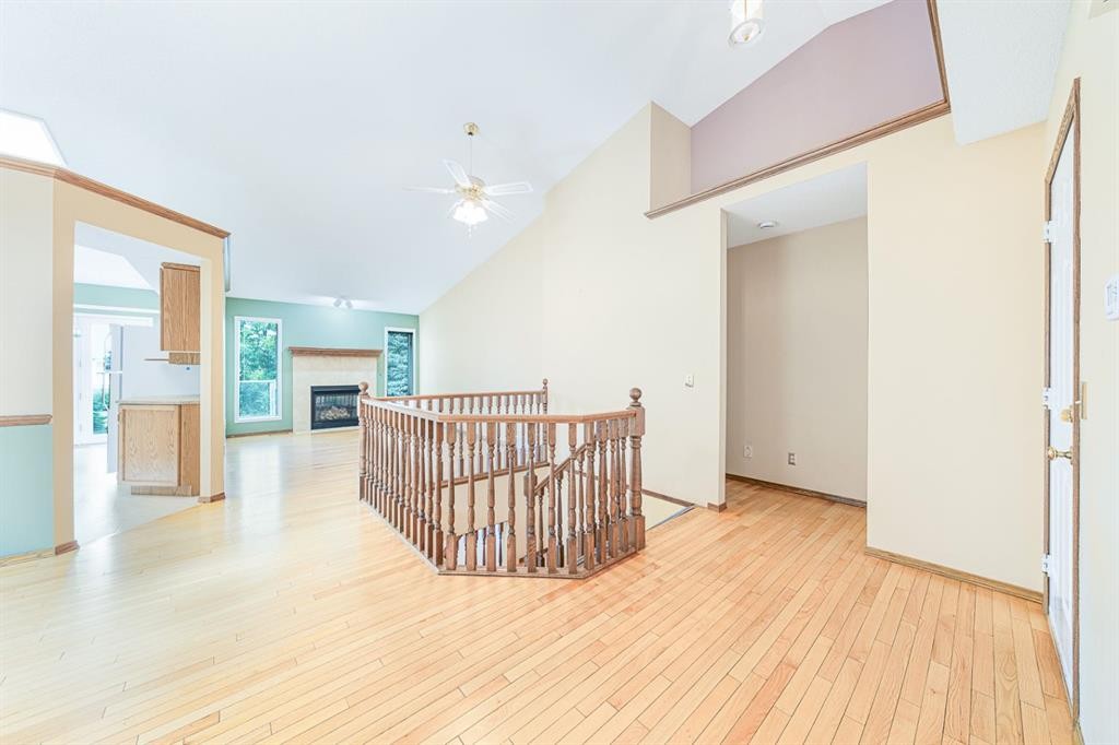 22 Douglas Woods Park Se, Calgary, AB - Indoor Photo Showing Other Room With Fireplace