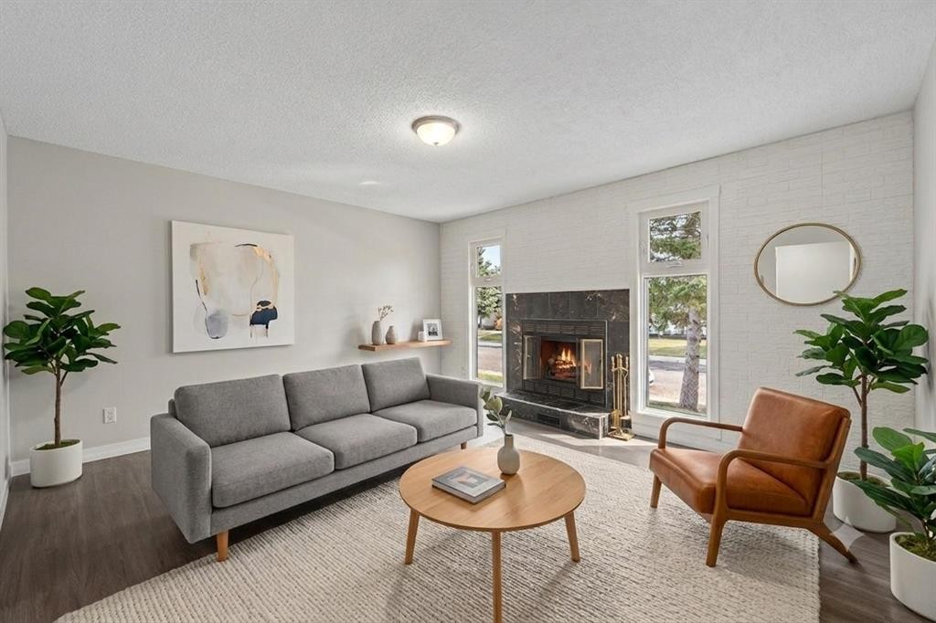875 Pinecliff Drive Ne, Calgary, AB - Indoor Photo Showing Living Room With Fireplace