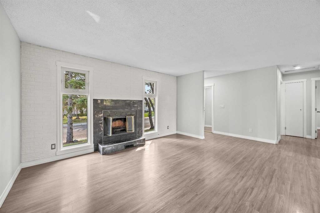 875 Pinecliff Drive Ne, Calgary, AB - Indoor Photo Showing Living Room With Fireplace