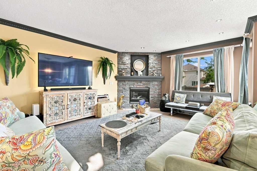 236 Chaparral Drive Se, Calgary, AB - Indoor Photo Showing Living Room With Fireplace
