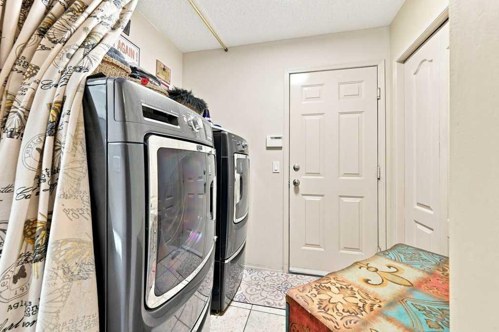 236 Chaparral Drive Se, Calgary, AB - Indoor Photo Showing Laundry Room