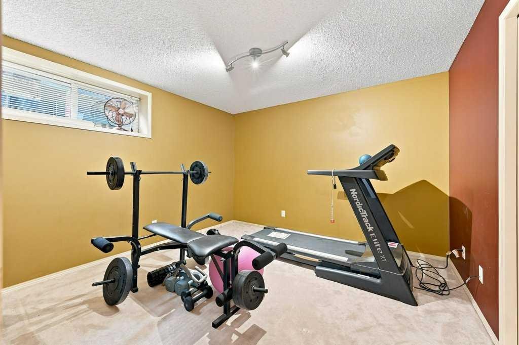 236 Chaparral Drive Se, Calgary, AB - Indoor Photo Showing Gym Room