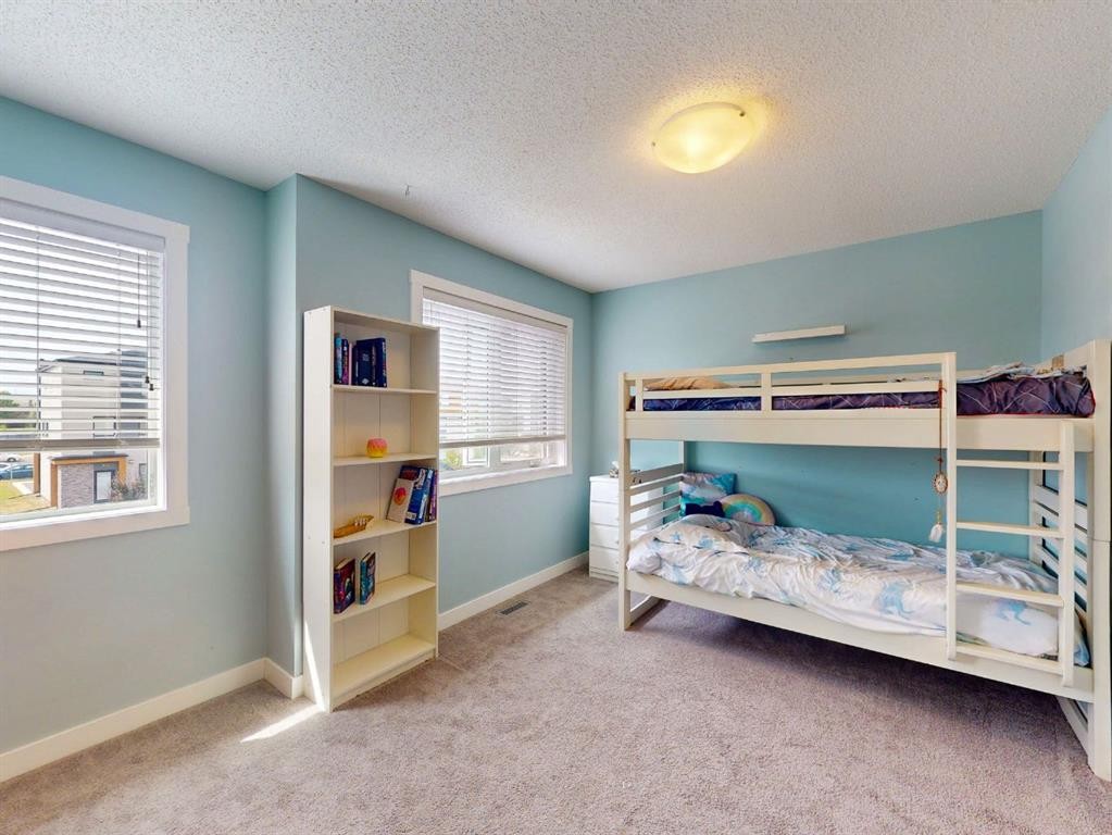 122 Midtown Boulevard Sw, Airdrie, AB - Indoor Photo Showing Bedroom