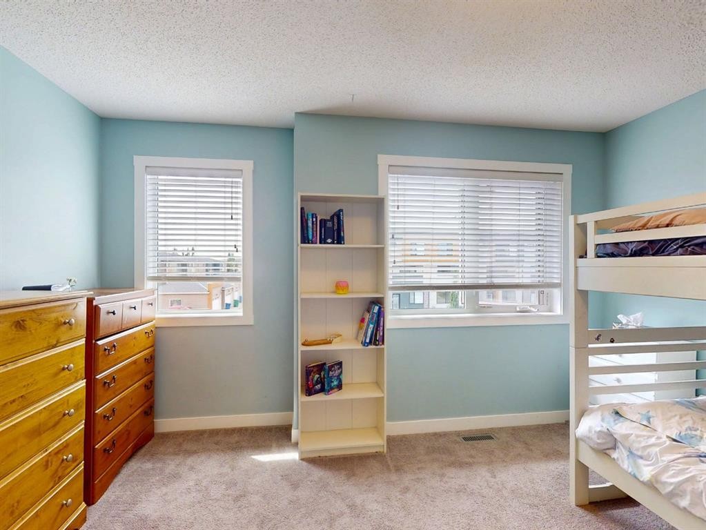122 Midtown Boulevard Sw, Airdrie, AB - Indoor Photo Showing Bedroom