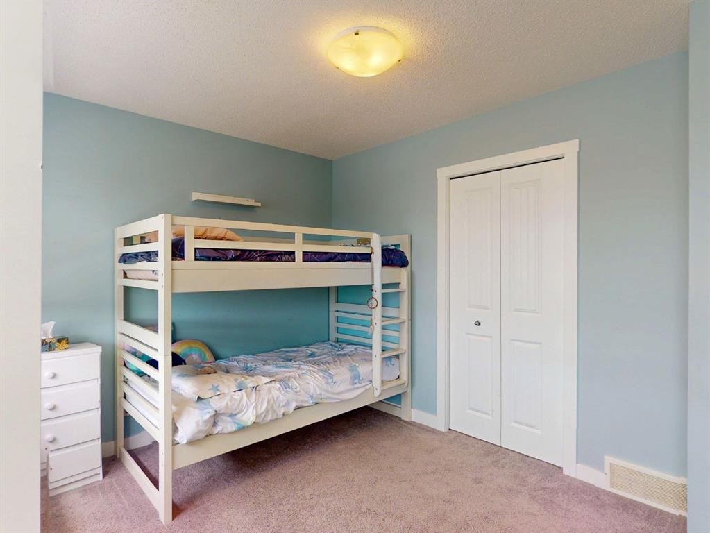 122 Midtown Boulevard Sw, Airdrie, AB - Indoor Photo Showing Bedroom