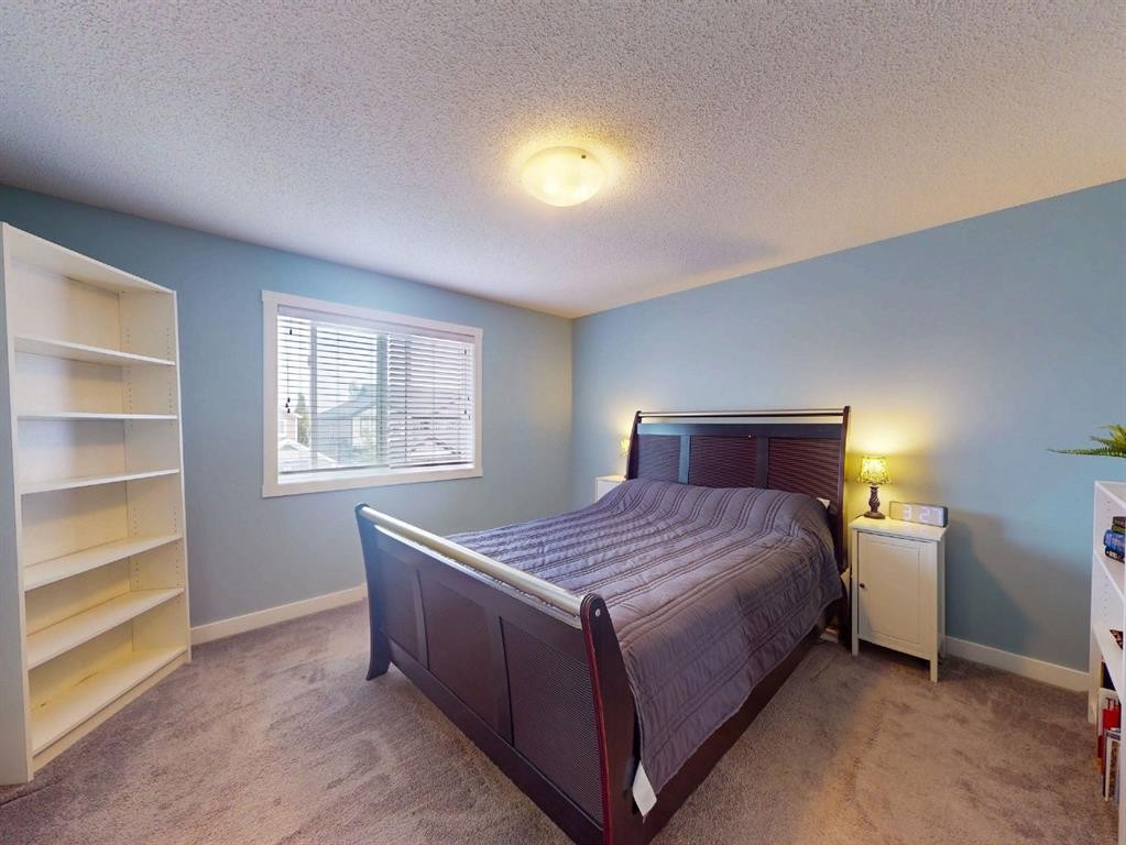 122 Midtown Boulevard Sw, Airdrie, AB - Indoor Photo Showing Bedroom