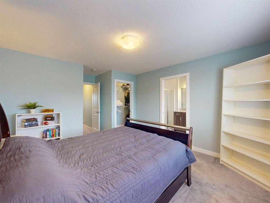 122 Midtown Boulevard Sw, Airdrie, AB - Indoor Photo Showing Bedroom