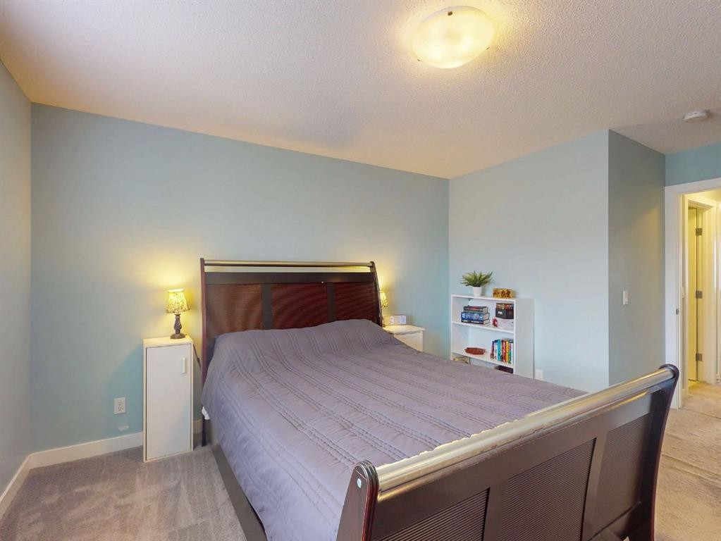 122 Midtown Boulevard Sw, Airdrie, AB - Indoor Photo Showing Bedroom